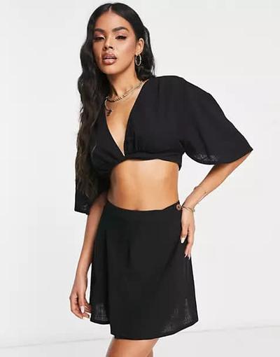 Asos  Design - Mini-jupe de plage d'ensemble coupe portefeuille - Noir 